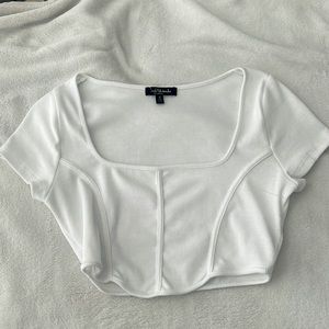 A crop top in the color white, small, I wore once